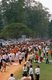 Cambodia: Laypeople and Buddhist monks, nuns and novices congregate after a mass almsgiving ceremony in the heart of Angkor Thom, Angkor
